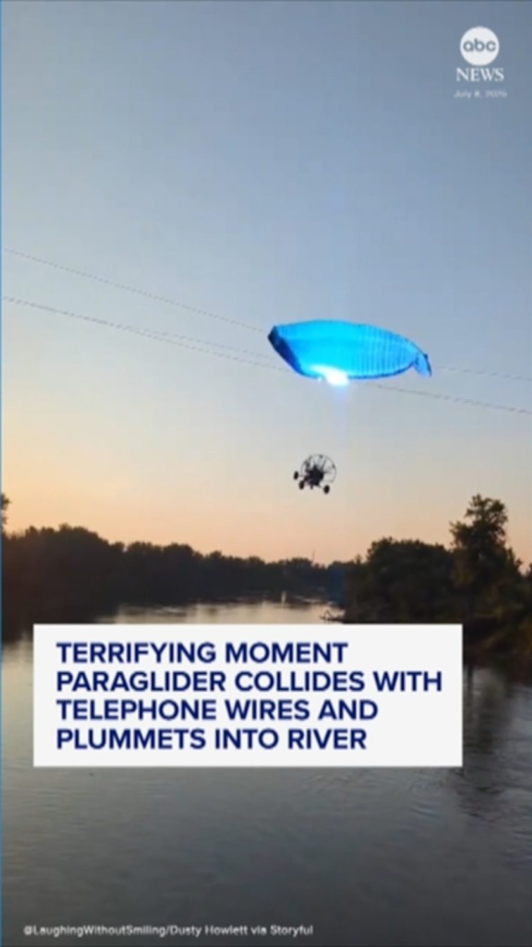 WATCH:  Paraglider hits phone lines and plunges into river